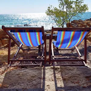 Deckchairs on Koh Samet beach overlooking the sea on Koh Samet island, Thailand
