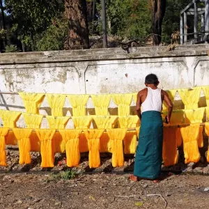 Dyeing and drying coloured yarn for the weaving industry in Amarapura, Mandalay, Myanmar