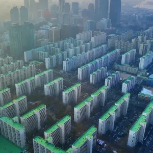 General view of blocks of flats and the Seoul city skyline at dusk in Seoul, Korea