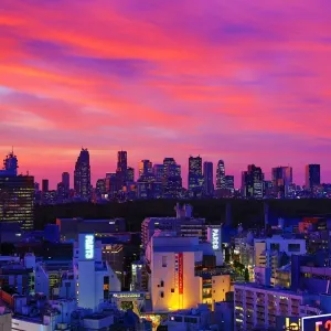 General view of the city skyline of Shinjuku at sunset seen from Shibuya, Tokyo, Japan
