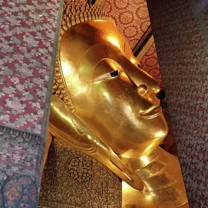 Giant gold reclining Buddha statue at Wat Pho Temple in Bangkok, Thailand