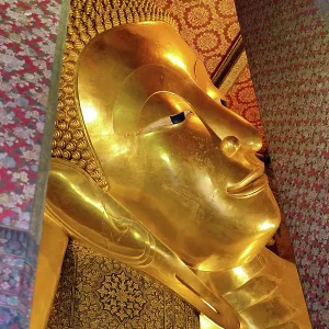 Giant gold reclining Buddha statue at Wat Pho Temple in Bangkok, Thailand