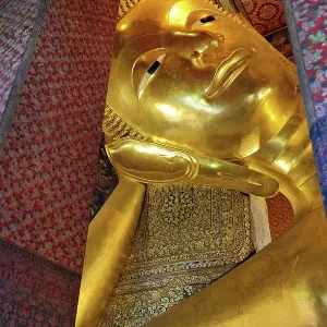 Giant gold reclining Buddha statue at Wat Pho Temple in Bangkok, Thailand