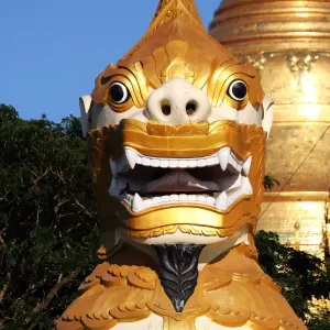 Giant lion statue at the entrance of the Shwedagon Pagoda, Yangon, Myanmar