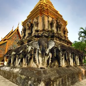 Gold chedi decorated with elephants in Wat Chiang Man Temple in Chiang Mai, Thailand