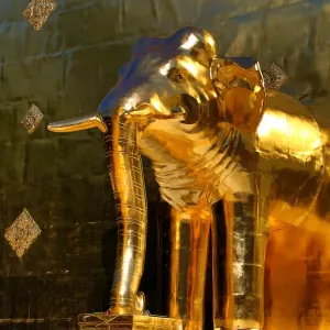 Gold elephant statue on the chedi at Wat Phra Singh Temple in Chiang Mai, Thailand