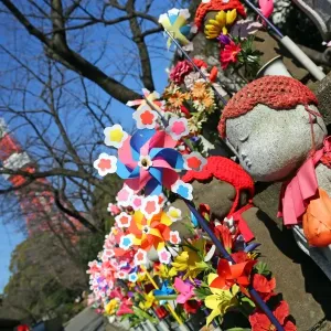 Jizo statues and pinwheel windmill toys in the Zojoji Temple cemetery garden