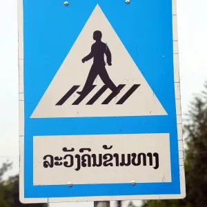 Lao pedestrian crossing sign in Luang Prabang, Laos