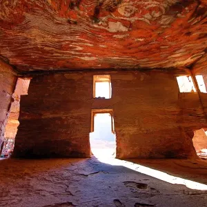 Light streaming through the windows of the Urn Tomb of the Royal Tombs in the rock city of Petra