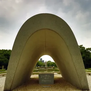 The Memorial Cenotaph and the Genbaku Domu, Atomic Bomb Dome, in the Hiroshima Peace Memorial Park, Hiroshima, Japan
