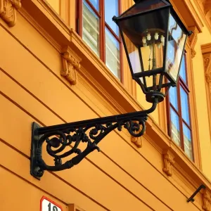 Metal street lamp on a building in Matoseva Ulica in Zagreb, Croatia