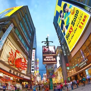 Night scene of illuminations and neon lights on buildings and shops and Kani Doraku