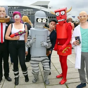 Participants dressed as characters from Futurama at MCM London Comic Con at Excel London
