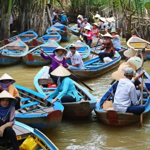 People on Sampan boats on canals on Con Lan (Unicorn) Island, near My Tho, Mekong Delta People on Sampan boats on canals on Con Lan (Unicorn) Island, near My Tho, Mekong Delta