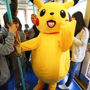 Pikachu rides the DLR to MCM London Comic Con