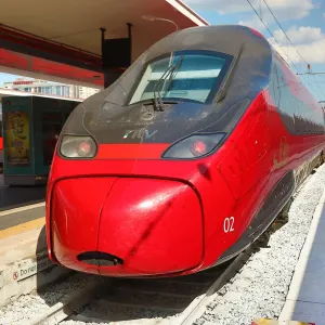 Red Italian high speed train in Naples station, Italy Red Italian high speed train in Naples station, Italy