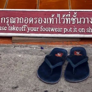 Take of your shoes sign at Wat Chedi Luang temple in Chiang Mai, Thailand