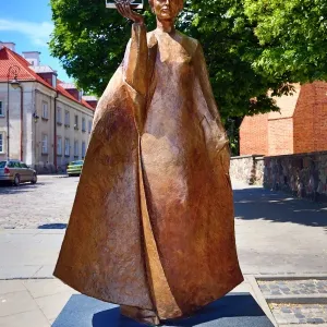 Statue of Marie Sklodowska-Curie holding a model of Polonium in Warsaw, Poland