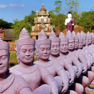 Statues forming a bridge at Muang Boran, The Ancient City, historical museum of reproductions of famous Thai buildings, Bangkok, Thailand
