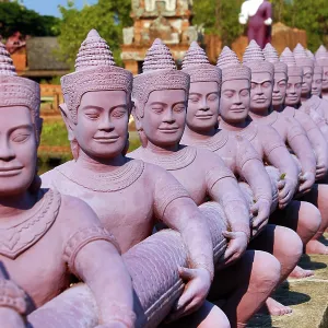 Statues forming a bridge at Muang Boran, The Ancient City, historical museum of reproductions of famous Thai buildings, Bangkok, Thailand