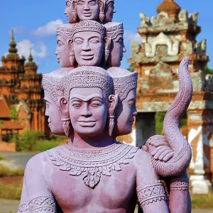 Statues forming a bridge at Muang Boran, The Ancient City, historical museum of reproductions of famous Thai buildings, Bangkok, Thailand