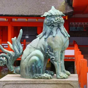 Stone lion statue at Itsukushima Shinto Shrine on Miyajima Island, Hiroshima, Japan