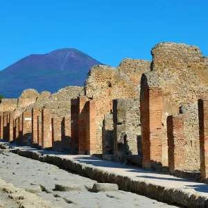 Street and ruins of houses in the ancient Roman city of Pompeii, Italy Street and ruins of houses in the ancient Roman city of Pompeii, Italy