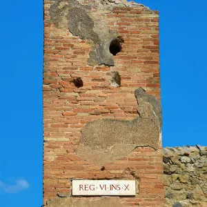 Street sign Rex VI ins X in the ancient Roman city of Pompeii, Italy Street sign Rex VI ins X in the ancient Roman city of Pompeii, Italy