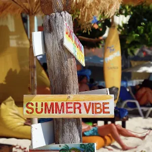 Summer vibe signs at a beach bar on Sai Kaew Beach, Koh Samet, Thailand