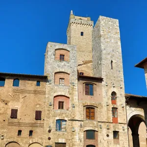 The Torre Grossa and buildings in the Piazza Cisterno in San Gimignano, Tuscany, Italy The Torre Grossa and buildings in the Piazza Cisterno in San Gimignano, Tuscany, Italy