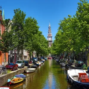 Tower of the Zuiderkerk, southern church, and the Groenburgwal canal in Amsterdam