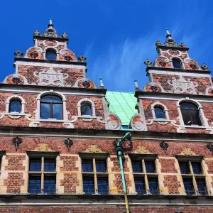 Traditional architecture of the Royal Copenhagen shop building roof in Stroget in Copenhagen