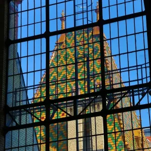 Traditional tiled roof seen through a metal framed window in Budapest, Hungary
