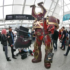 A Warhammer Chaos Space Marine dwarfs participants at MCM London Comic Con at Excel