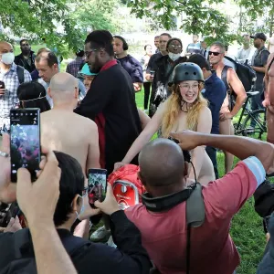 Naked cyclists gather in Hyde Park before the World Naked Bike Ride