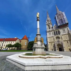 Zagreb Cathedral with tower renovation and Holy Mary Monument column in Zagreb, Croatia