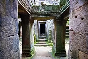Arched walkways and pillars in the ruins of Bayon Temple, Angkor Thom, Siem Reap