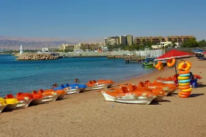 Amman And Jordan: The beach at Aqaba in Jordan looking towards Eilat in Israel