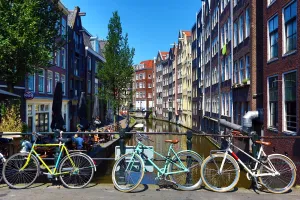 Amsterdam: Bicycles on a bridge on the Oudezijds Achterburgwal canal and houses in Amsterdam