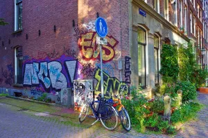 Amsterdam: Bicycles parked in the street with grafitti in Amsterdam, Holland