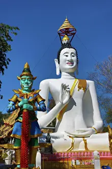 Editor's Picks: Big white Buddha statue and temple guardian at Wat Ko Kaew Pitsadan Temple