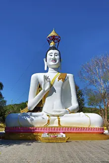 Statues: Big white Buddha statue at Wat Ko Kaew Pitsadan Temple, Koh Samet, Thailand
