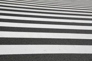 Roads: Black and white lines of a Japanese zebra pedestrian crossing in Ginza, Tokyo, Japan