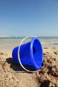 Stock Geography: Blue toy bucket on the beach