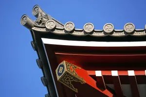 Symbols: Buddhist cross symbol on a roof at the Sensoji Asakusa Kannon Temple, Tokyo, Japan