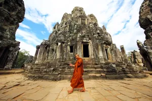 Ancient: Buddhist monk in the ruins of the Bayon Khmer Temple, Angkor Thom, Siem Reap, Cambodia