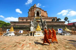 Chiang: Buddhist Monks at Chedi at Wat Chedi Luang Temple in Chiang Mai, Thailand