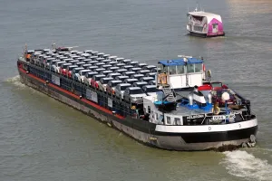 Budapest, Hungary: Cargo ship transporting motor cars on the River Danube, Budapest, Hungary