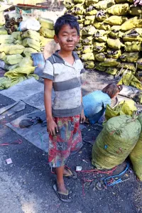 Industry: Children making and collecting charcoal in Amarapura, Mandalay, Myanmar (Burma)
