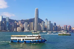 Tall: The city skyline of the Central area of Hong Kong and ferries in Victoria Harbour in Hong Kong